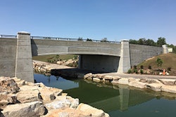 Creating a very distinguishing look for the park’s new vehicular bridge, the arched bridge fascia panels, cast with wood grain finish, were installed three on each side of the bridge and the column pier caps were mounted on top of the bridge columns.