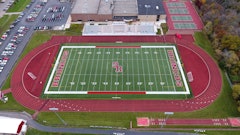 Approximately 1,800 tons of E mix asphalt was placed in two layers. ACI laid the base course, placed tack and then placed the surface course of the running track.