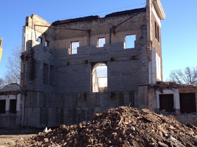 North Hall required conventional demolition. However, it also required an extensive amount of hand demolition, shoring and artifact removal and preservation. Custom fabricated scaffold systems were necessary to access and shore existing components.
