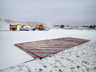 Iowa State engineers don't need a plow to clear snow from the heated test slabs they installed at the Des Moines International Airport.