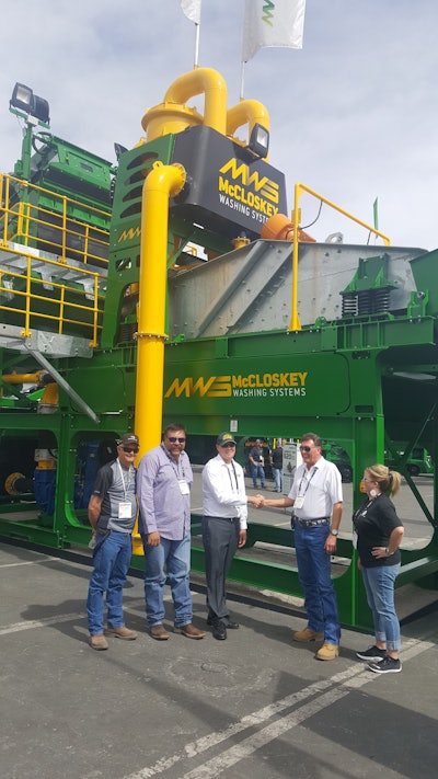 Excel Machinery Ltd & McCloskey Washing Systems shaking dealership. Left to right: David Timmons, Charles Romero, Craig Rautiola (MWS), Matt Garth & Jenifer Payne