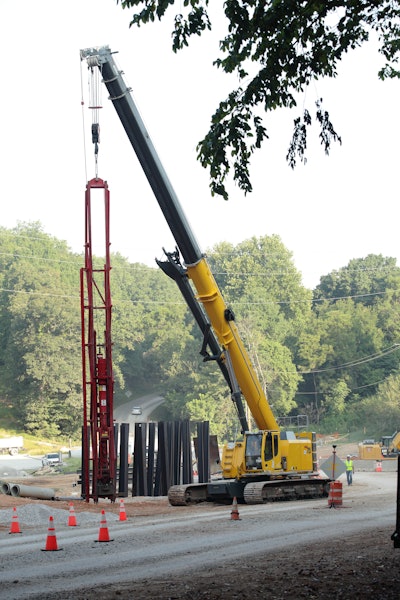The 75-ton crane drove approximately 40 H-beam piles into the creek bed using an 8.5-ton diesel pile hammer. The height was 93 ft. for each pile.
