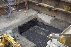 The height restrictions meant tight-sheeting could only be driven at night. Instead, Midwest REM chose an Efficiency Production manufactured Slide Rail System with integrated guard rail to shore the large excavation.