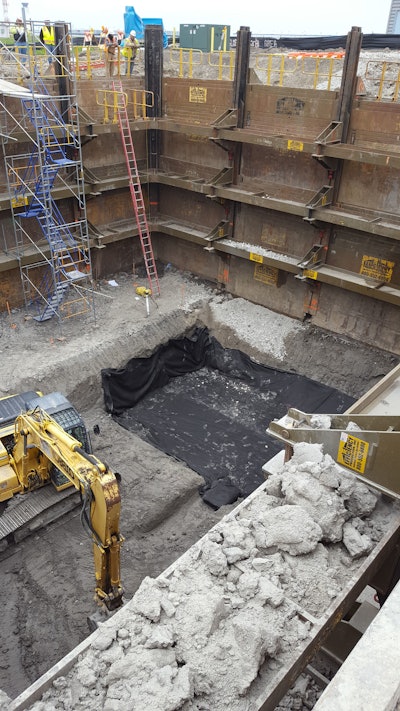 The height restrictions meant tight-sheeting could only be driven at night. Instead, Midwest REM chose an Efficiency Production manufactured Slide Rail System with integrated guard rail to shore the large excavation.