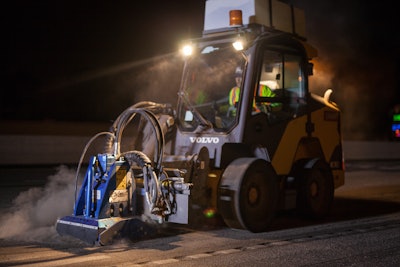 Nighttime motorists driving along the I-5 highway may spot the Volvo MC115C skid steer at work removing reflective pavement markers from the pavement.