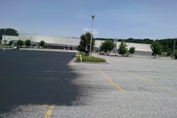 The first step was cleaning the pavement using walk-behind blowers, brooms and sweeping equipment. That was followed by cracksealing and the first coat of sealer.