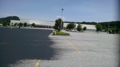 The first step was cleaning the pavement using walk-behind blowers, brooms and sweeping equipment. That was followed by cracksealing and the first coat of sealer.