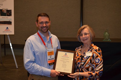 Nickell Rental Hiram Branch Manager Jason Pierce accepts the President's Image Award from ARA Region Three Director Peggy DeFrancisco at The Rental Show in Orlando.