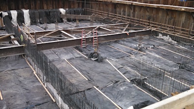 The contractor did a careful job of insulating the concrete to prevent temperature differentials greater than 35ºF. However the vertical rebar must also be insulated because steel is a good conductor of heat.