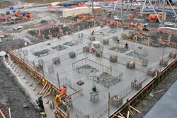 Reinforcing bars protruding from some slabs prevent the use of mechanical placement aids such as vibrating screeds.