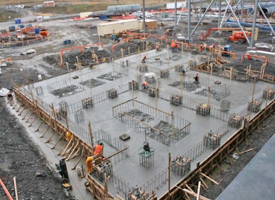 Reinforcing bars protruding from some slabs prevent the use of mechanical placement aids such as vibrating screeds.
