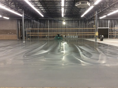 Unvented heating can cause serious problems to fresh concrete. This nicely finished floor carbonated within the first couple days, causing the surface to pull up when tape was removed.