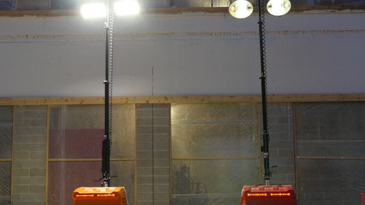 Light emitted by LED (left) is whiter and more like daylight than that given off by a metal halide (right) light tower.