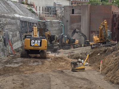 The existing structure of the University of Minnesota’s old heating plant was completely gutted. This included walls, ceilings, mechanical-plumbing-electrical systems