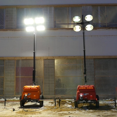 Light emitted by LED (left) is whiter and more like daylight than that given off by a metal halide (right) light tower.