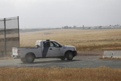 A Customs and Border Protection truck patrols the border fence east San Diego. The region has been deemed a high priority for President Donald Trump's new border wall, which is scheduled to begin construction in September. (Alejandro Tamayo / Tribune News Service)