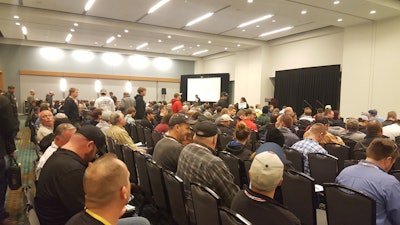 Contractors look to find a seat before the start of one of NPE 2017's standing room-only educational sessions.