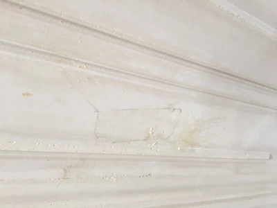 A 12-foot long 2x4 weighting 15 pounds shot from an air-canon at 130 mph hit this concrete double-wall panel. The board exploded into small slivers of wood, leaving only an outline mark of its impact with the concrete.