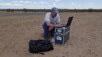 One of Power Engineers’ licensed remote pilots, Andy Bartos, at flight control station.