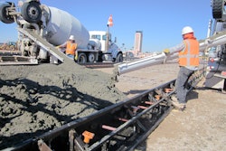 Transit mixers delivered concrete from both sides alongside these reversible (DUAL) forms.