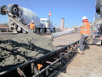 Transit mixers delivered concrete from both sides alongside these reversible (DUAL) forms.