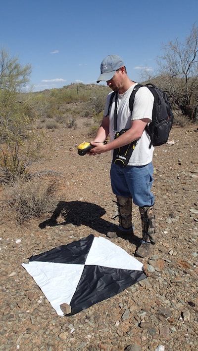 Power Engineers' licensed remote pilot Andy Bartos laying out ground control points.