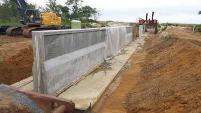 A concrete flood wall is being constructed to help reduce flooding as part of the Port Monmouth Flood Risk Management Project in Port Monmouth, New Jersey.