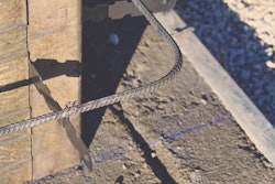 Chalk lines on the footing designate the inner formwork wall line. The width of the footing minus the wall thickness should leave enough footing along the outside to support the wall forms.