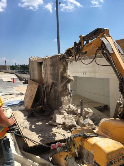 To prevent debris damage, crews placed double layers of plywood and tires below the structure on all sides to cushion the blow from falling concrete.