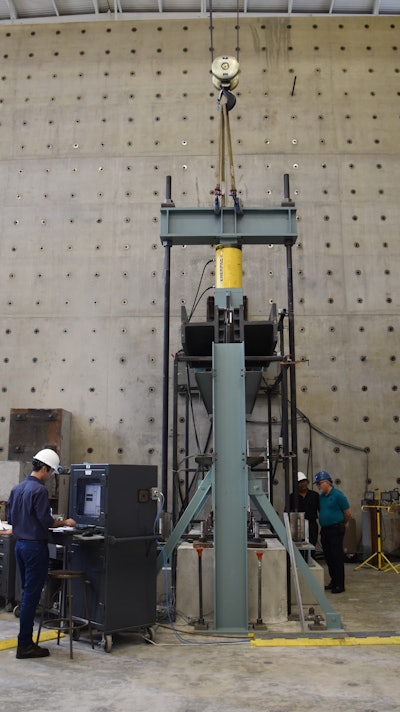 Preliminary results of the first of six physical tests on coupled steel-plate composite shear-wall specimens indicate excellent behavior and cyclic performance.