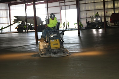 Milis Flatwork, Kaukauna, Wis. working on a 40,000 square foot warehouse expansion. Seventy trucks delivered almost 700 cu. yds. of concrete. Wacker Neuson trowels were used to finish the slab.