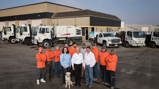 The Jacketta Sweeping Service team (from left, back row): Tyson Cook, driver; Denton Taylor, truck washer; Connee Pierce, driver; Sheldon Haworth, driver; Parker Haworth, driver; Charles Gould, mechanic; John Henderson, CDL operator; Nathan Haroldsen, CDL operator; Andrew Webber, CDL operator; (front row, from left) Kara Moore, office manager; Debbie Jacketta, president; Craig Dunham, operations...and Rocco. Not pictured: Parker Evans, Paul Mushumba, Marvin Wade.