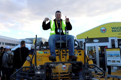 Derek Gromacki, PJ Dick, Inc., Pittsburgh, Pa. sits on his new custom 48-inch CRT48-35V ride-on trowel powered by a special Vanguard BIG BLOCK V-twin engine. Gromacki won the grand prize trowel for being the most precise and fastest operator to compete in Wacker Neuson’s Trowel Challenge competition held at World of Concrete in Las Vegas.