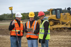 Workers go over last-minute procedures before entering a construction red zone. The crew uses Cat Detect passive technology that sounds loud, distinct alerts, warning that personnel or fixed objects are in an unsafe space.