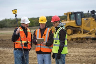 Workers go over last-minute procedures before entering a construction red zone. The crew uses Cat Detect passive technology that sounds loud, distinct alerts, warning that personnel or fixed objects are in an unsafe space.