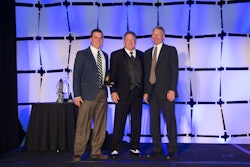Jake Bernath (left) and his father, David Bernath (right) appear with Bob Wallace, SealMaster field representative, as they receive an award for the performance of their Indianapolis-based franchise. They are the new owners of SealMaster/Louisville, which serves all of Kentucky.