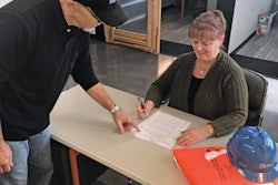 Safety manager Kirk Waggoner guides Jacque Cato, safety assistant, through the company’s snow removal protocol.
