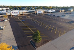Initially the job was a mill and fill project. Asphalt Contractors had intended to just do a small patch but the inspector read the plans and determined the entire parking lot had to be milled, paved and striped before the stores could open.