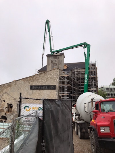 The 40Z-meter is pumping a solid concrete cap of which to attach new roof trusses during the revitalization of the historic hotel.