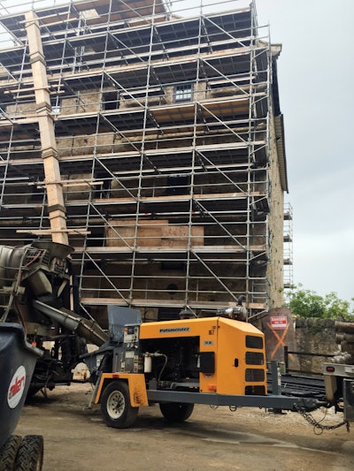 The Thom-Katt TK 50 pumped a lean concrete mix for filling voids in the existing hotel's basement, as there was no efficient way to get gravel down a stairwell as well as then compact it.