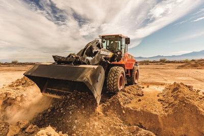 Even paint schemes can help with visibility. The lower contrast of Doosan's charcoal lift arm with the background allows the eyes to shift focus to the background, which provides the optical perception of improved visibility to the work area.
