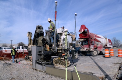 Using AutoPilot and in offset mode, Fox's SP 15i places curb and gutter in reconstructed parking lot of manufacturing plant.