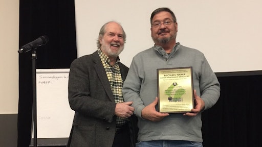 Ranger Kidwell-Ross (left) presents the WSA Award of Excellence in Power Sweeping to Michael Nawa.