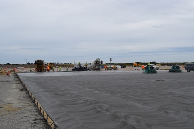 Figure 1: Large slab on grade placement utilizing truck dump and laser screed strike-off.