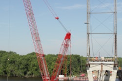 A Manitowoc MLC300 crawler crane was used to lift arch rib sections into place during replacement of an 84-year-old Illinois truss bridge