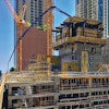 Putzmeister concrete pumping equipment stands tall as the Vista Tower ascends in downtown Chicago.