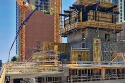 Putzmeister concrete pumping equipment stands tall as the Vista Tower ascends in downtown Chicago.