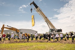 With shovels in hand, Mrs. Sophie Albrecht, Jan Liebherr, Liebherr USA, Co. Managing Directors, its building partners and government officials broke ground during the ceremony. From left: Terrence Leo, Cort Reiser (Liebherr Mining Equipment Newport News, Co), Dave France (Kimley-Horn & Associates, Inc.), Michael Molzahn (HBA Architecture & Interior Design, Inc.), Peter Mayr, Managing Director, Cheri Cook, Finance Director (Liebherr USA, Co.) Gary Minter, Sharon Scott, Florence Kingston, Tina Vick (Newport News City Officials), Jan Liebherr, Mrs. Sophie Albrecht (Administrative Board, Liebherr-International AG), McKinley Price, Mayor, city of Newport News, Ms. Charlotte Liebherr, Torben Reher, Daniel Pitzer (Managing Directors of Liebherr USA, Co.), Michael Daniels, Danny Lee and John Lawson (WM Jordan), Juergen Mayer, Liebherr Purchasing Services GmbH.