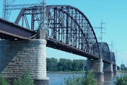 Bids were accepted in February, but in June the administration denied a grant that would have financed a third of the cost to replace The Merchant's Bridge, a Mississippi River rail crossing at St. Louis. Coupled with the escalating cost of the necessary 12,500 tons of steel, the project's future is uncertain.