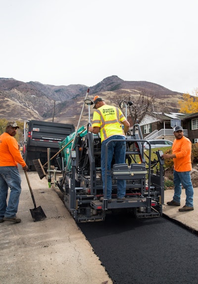 In South Ogden, UT, Aspen Paving Inc. places asphalt in 6-ft.-wide secondary water line cut.